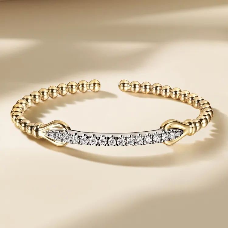 Gold and silver bracelet with diamond accents, available at Jim Kryshak Jewelers in Wausau.
