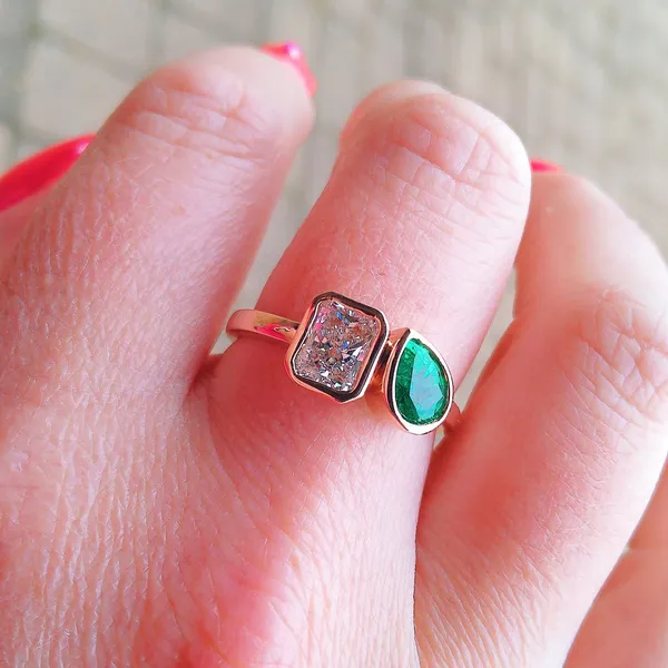 Two-stone diamond and emerald ring