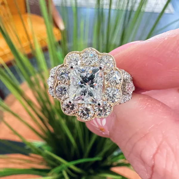 Vintage-style halo engagement ring