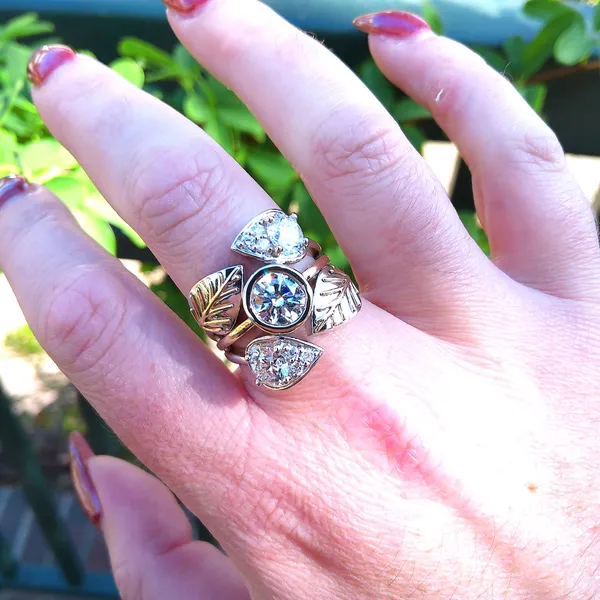 Custom leaf ring with a round diamond