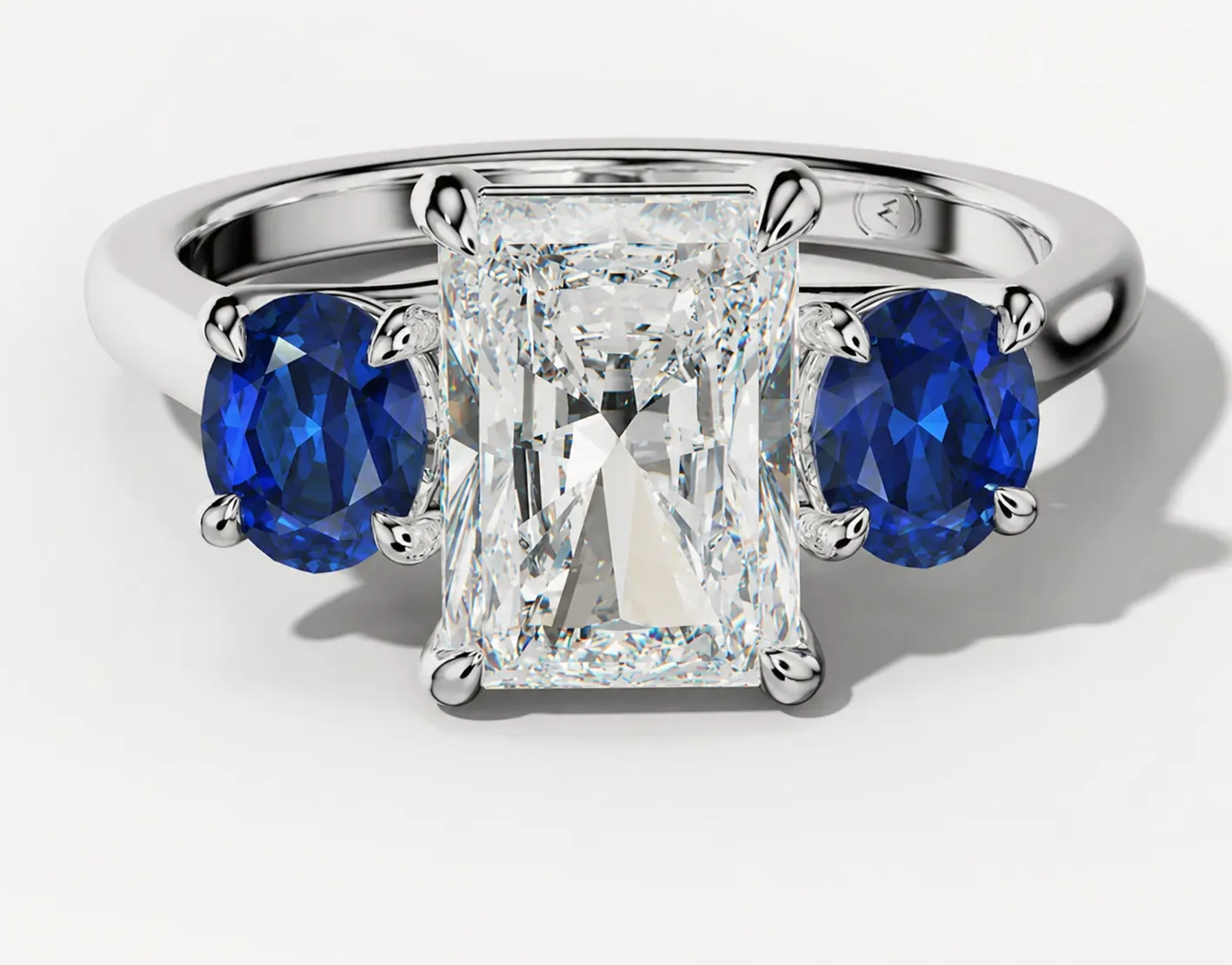 Three custom jewelry designs: an amethyst ring, blue topaz earrings and a citrine pendant