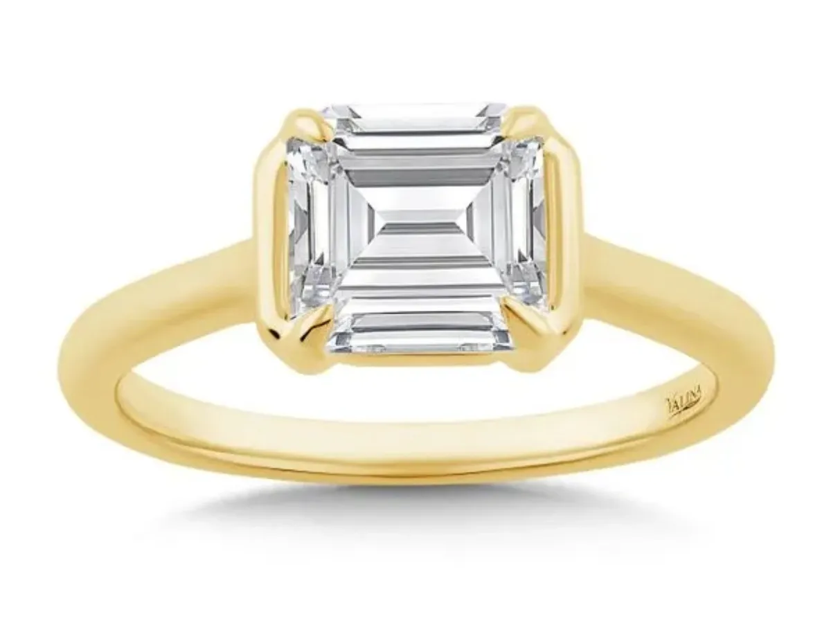 Gold emerald cut diamond solitaire ring