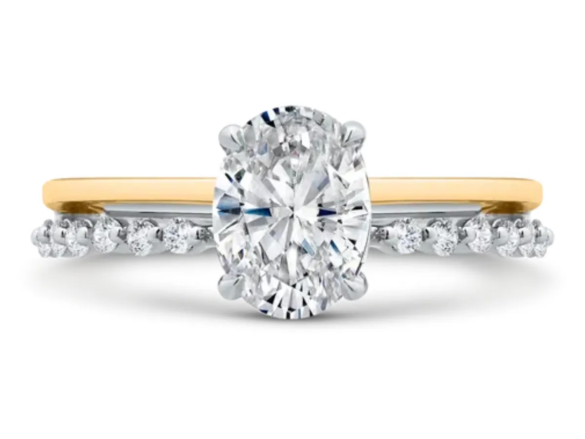 Oval diamond engagement ring with pav&eacute; band