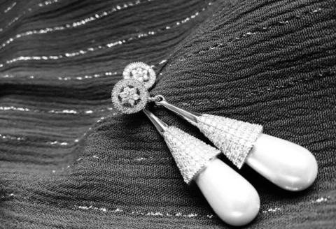 Diamond earrings with teardrop pearl design