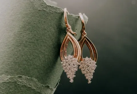 Gold teardrop diamond earrings with sparkle