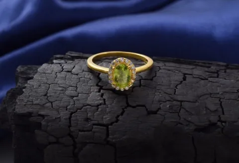 Gold gemstone engagement ring with peridot