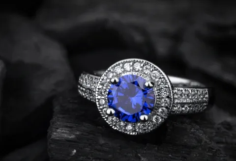 Blue sapphire gemstone engagement ring with diamonds.