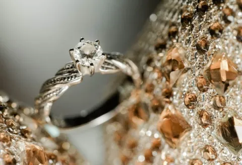Custom engagement ring with intricate metal band.