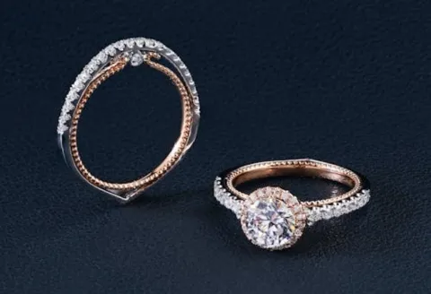 Rose gold diamond engagement ring set on display.