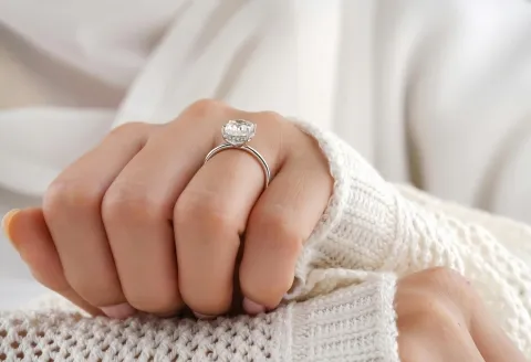 Custom design engagement ring on hand
