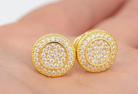 Gold stud earrings with a circular design