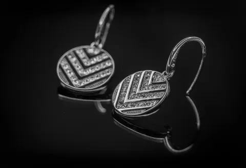 Silver drop earrings with chevron pattern detailing