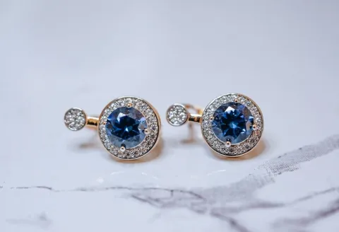 Diamond earrings with gemstone accent