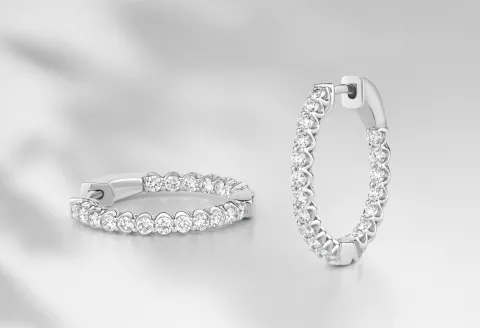 Silver hoop earrings with diamond accent