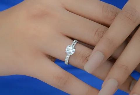 Close-up of diamond ring on hand