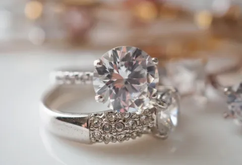Silver engagement ring with round diamond centerpiece