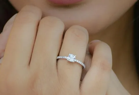 Woman wearing diamond engagement ring