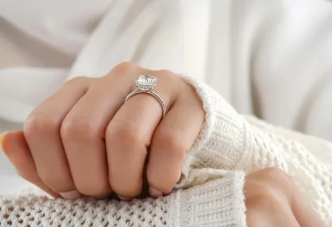 Woman wearing silver diamond engagement ring