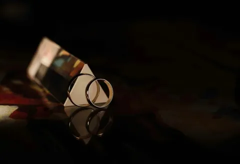 Men's wedding band with gold ring reflection