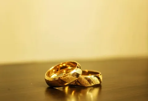 Textured gold men's wedding band pair