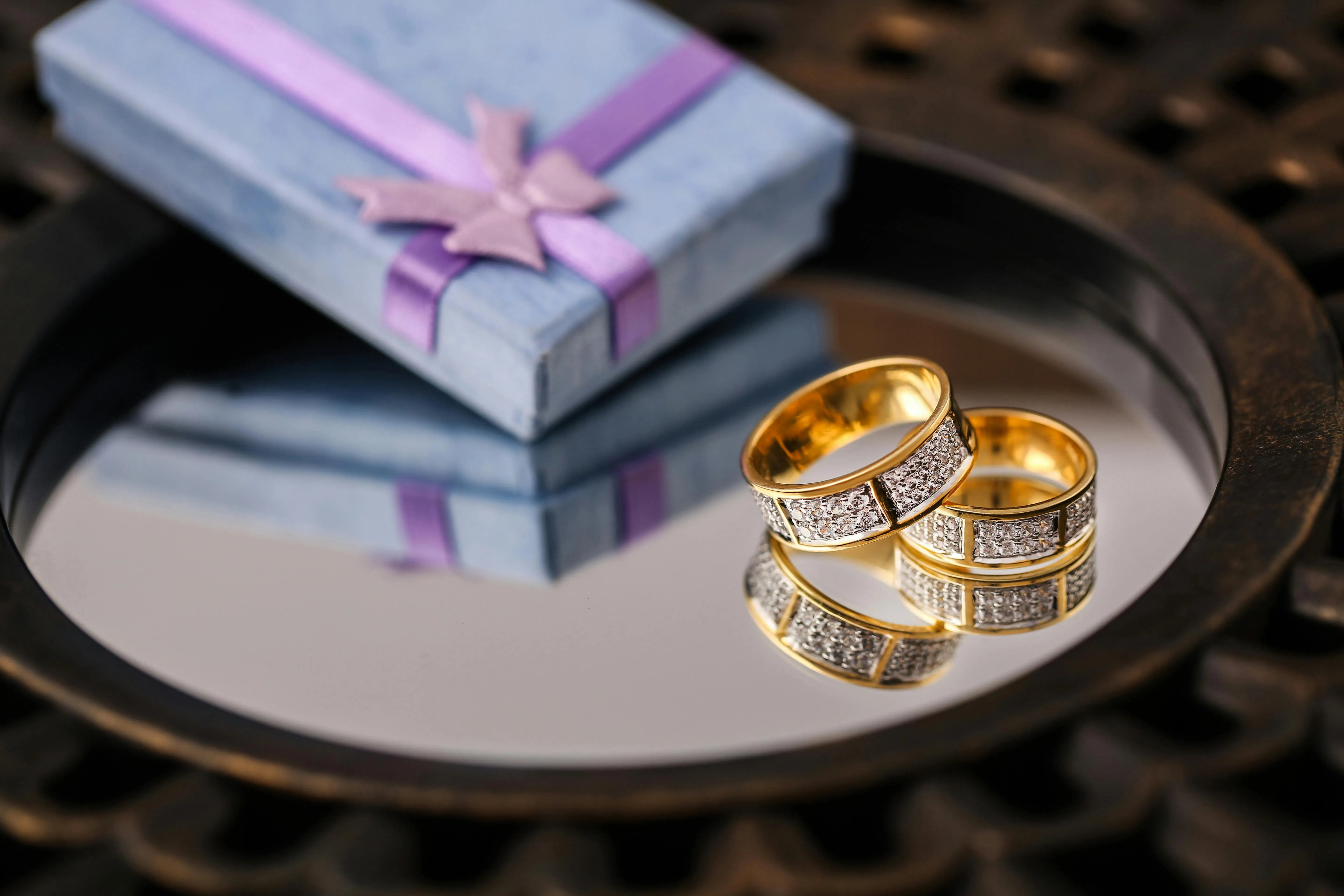 Gold wedding band reflection in mirror