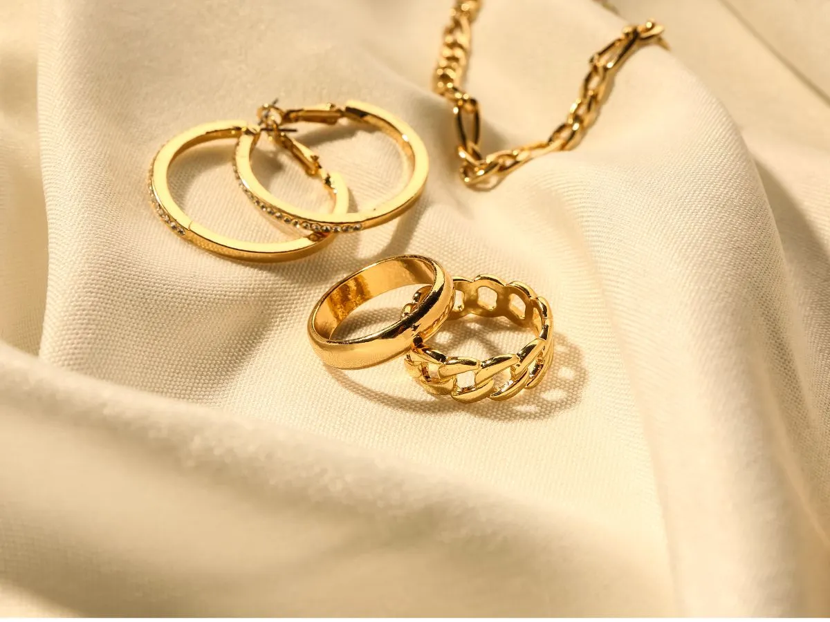 Gold jewelry rings and earrings displayed