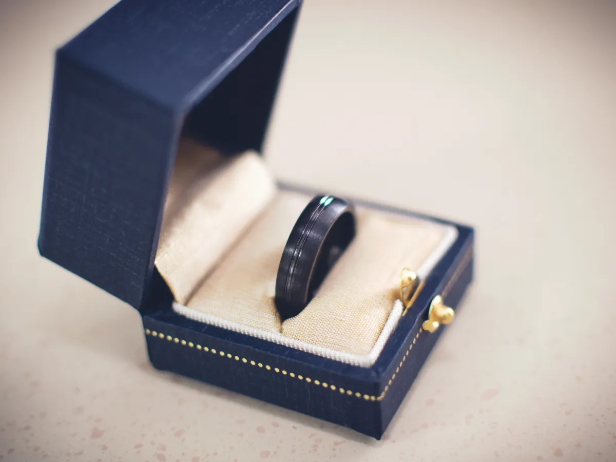 Side view of wedding band on jewelry box