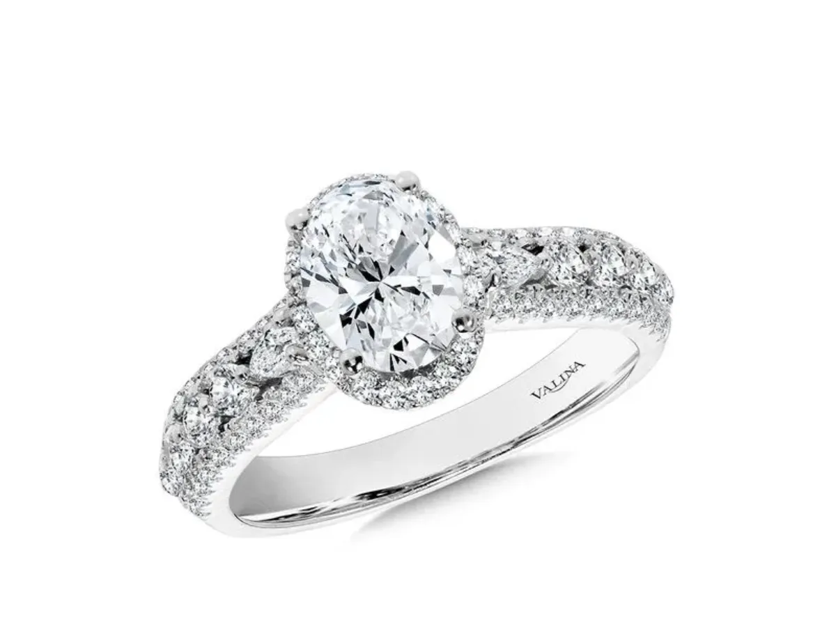 Oval halo diamond engagement ring with pavé white gold band