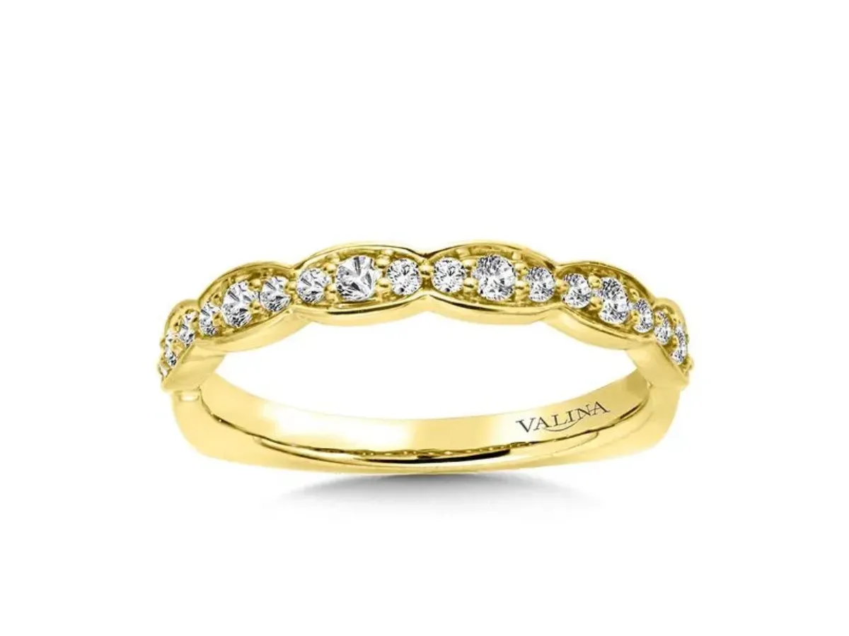 Curved yellow gold diamond wedding band with round accents