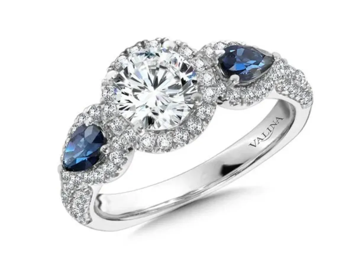 Round diamond ring with sapphire side stones in white gold