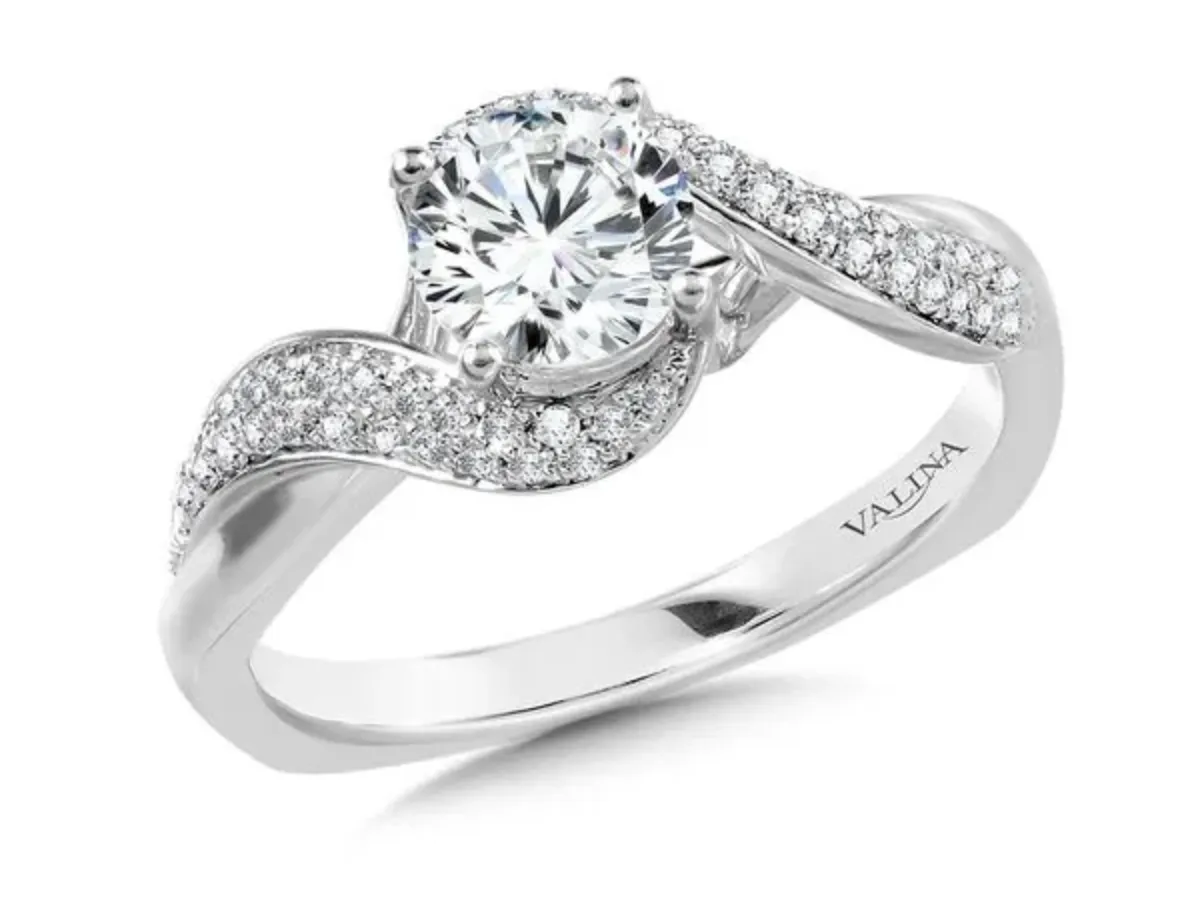 Twisted pav&eacute; diamond engagement ring in white gold