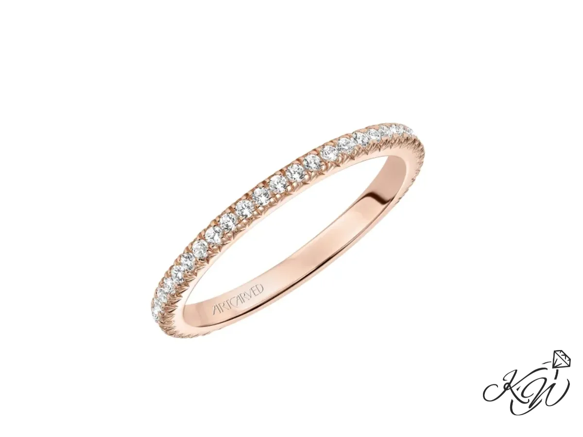 Yellow gold twisted diamond wedding band with pavé stones