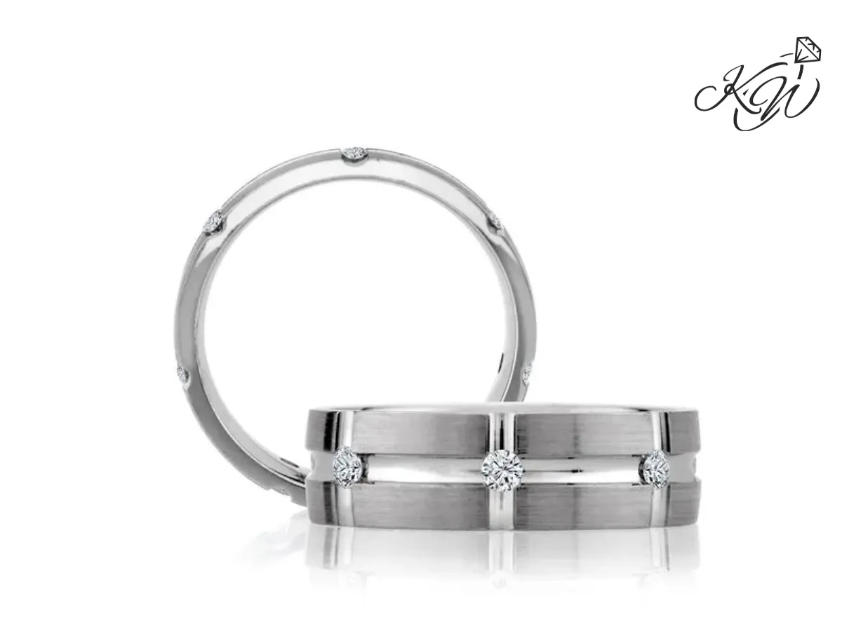Brushed white gold wedding band with diamond accents