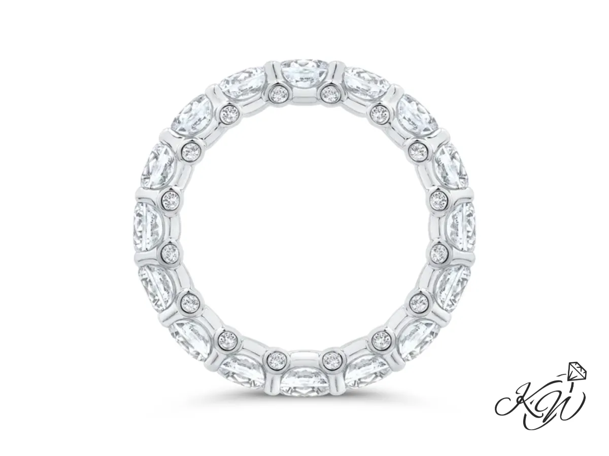 White gold diamond eternity band with round bezel accents