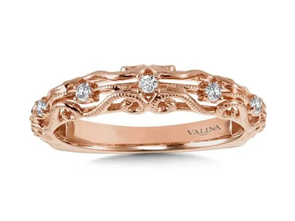 Intricate engraved scrollwork and milgrain detailing.