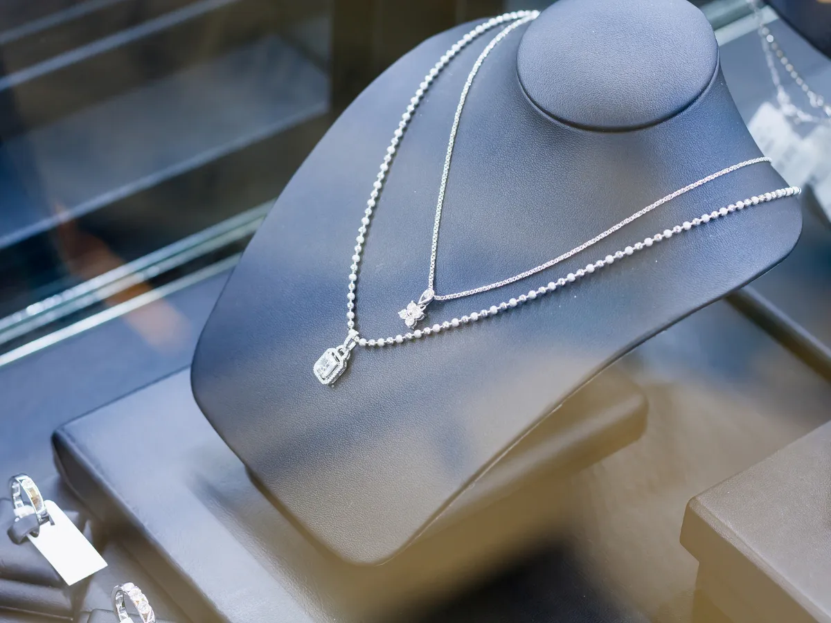 Diamond necklaces in glass case at jewelry store