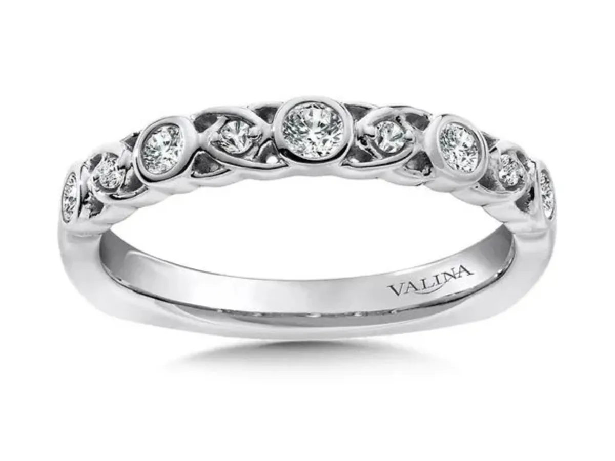 White gold diamond band with bezel set round stones