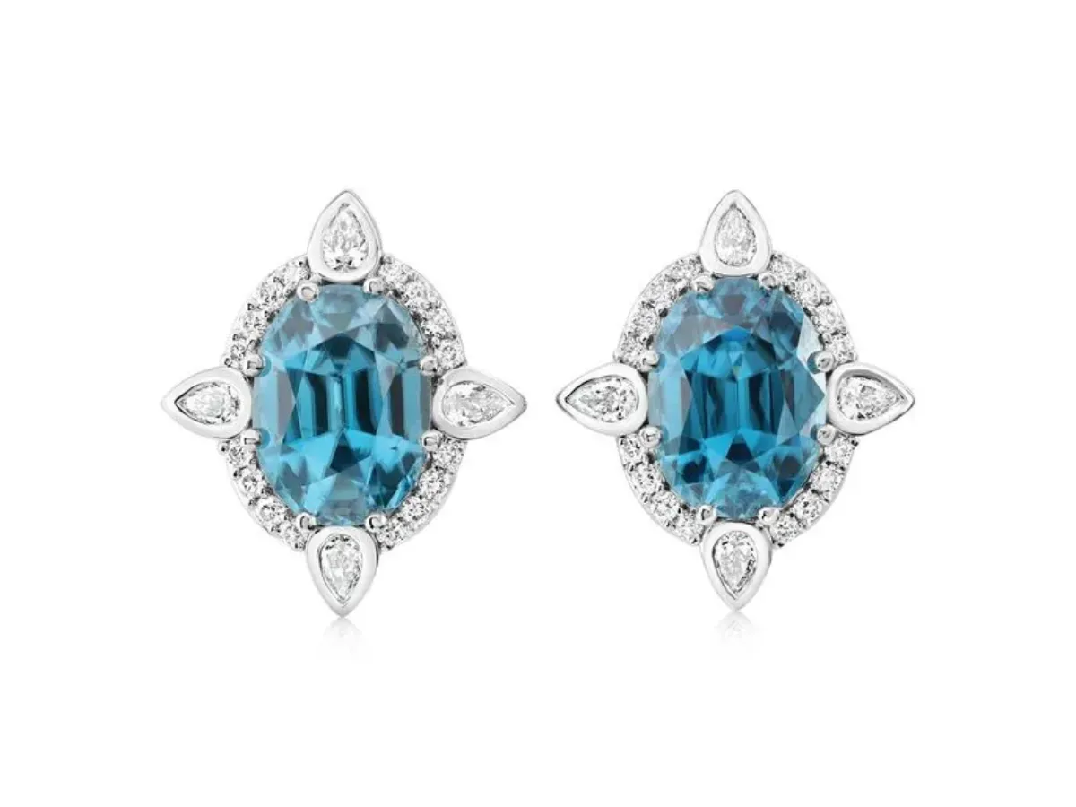 Blue gemstone halo earrings with diamond accents