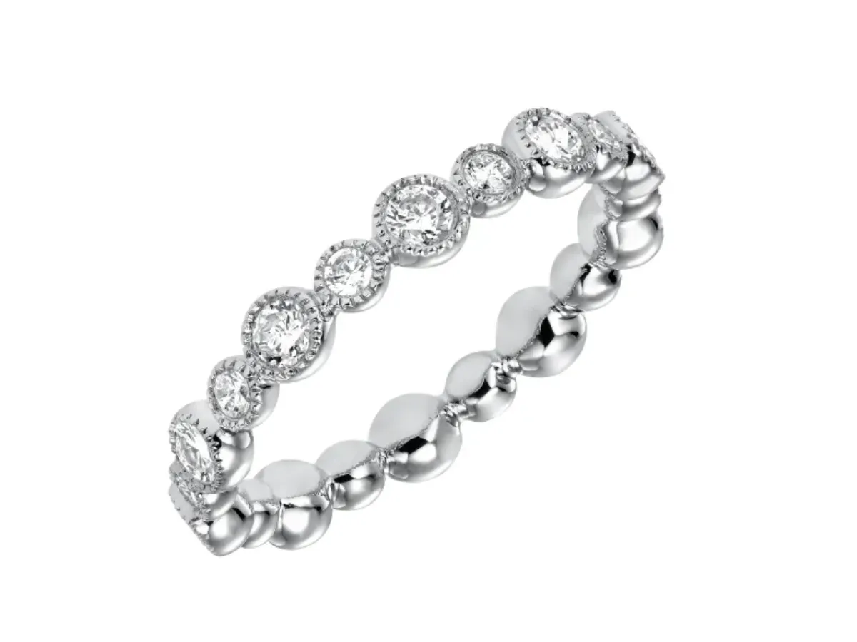 Diamond eternity ring with bezel set round stones