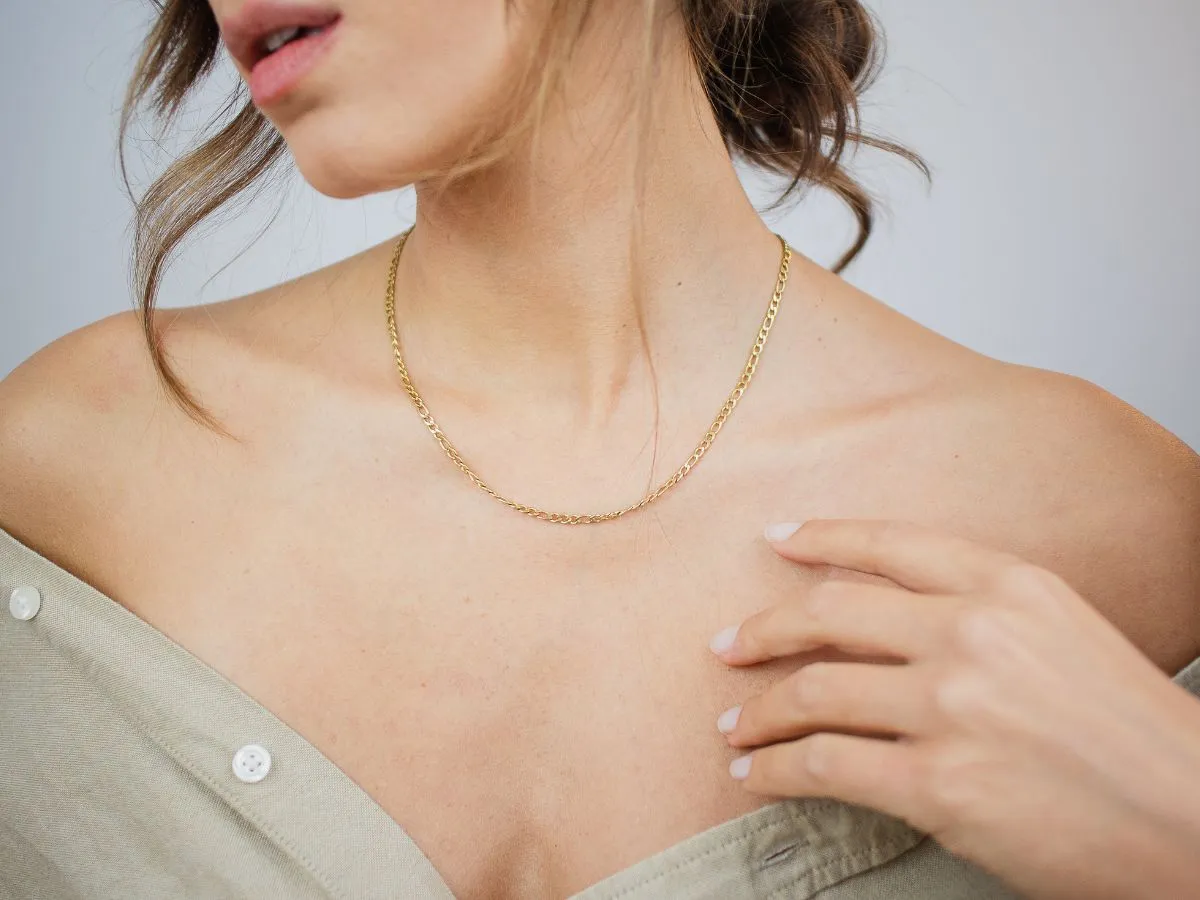 Woman wearing gold chain necklace