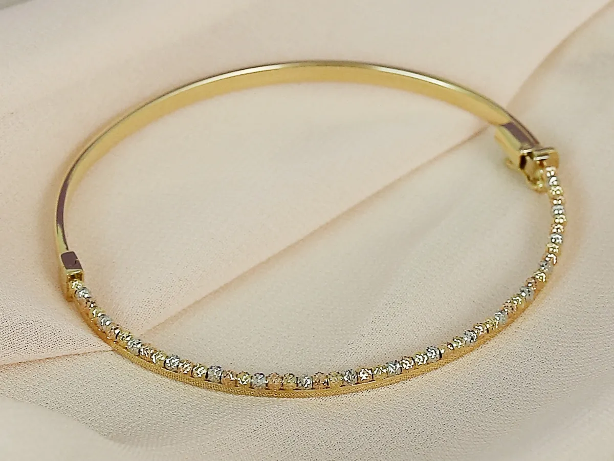 Gold bangle bracelet with diamonds