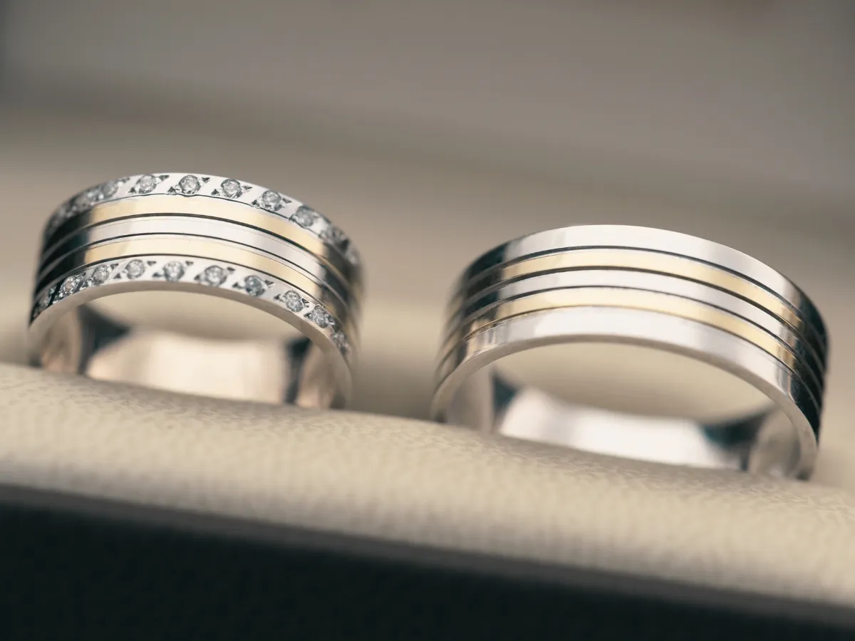 Diamond-studded wedding bands in box
