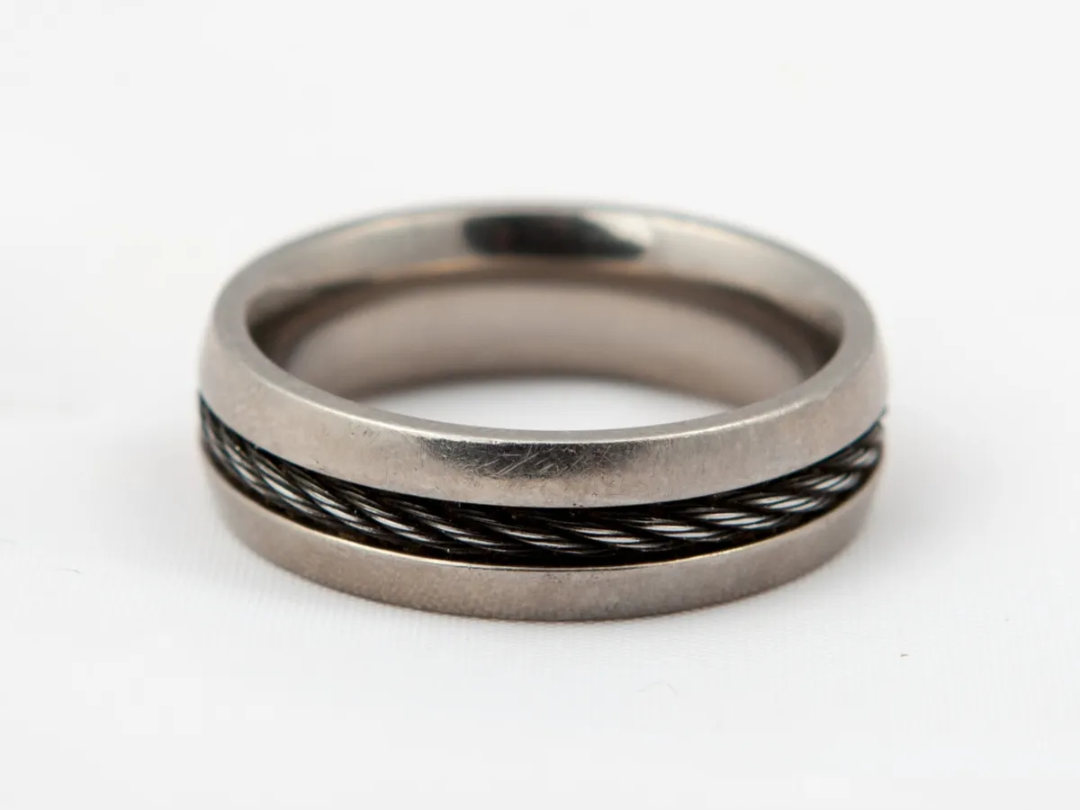 Silver ring with black wire