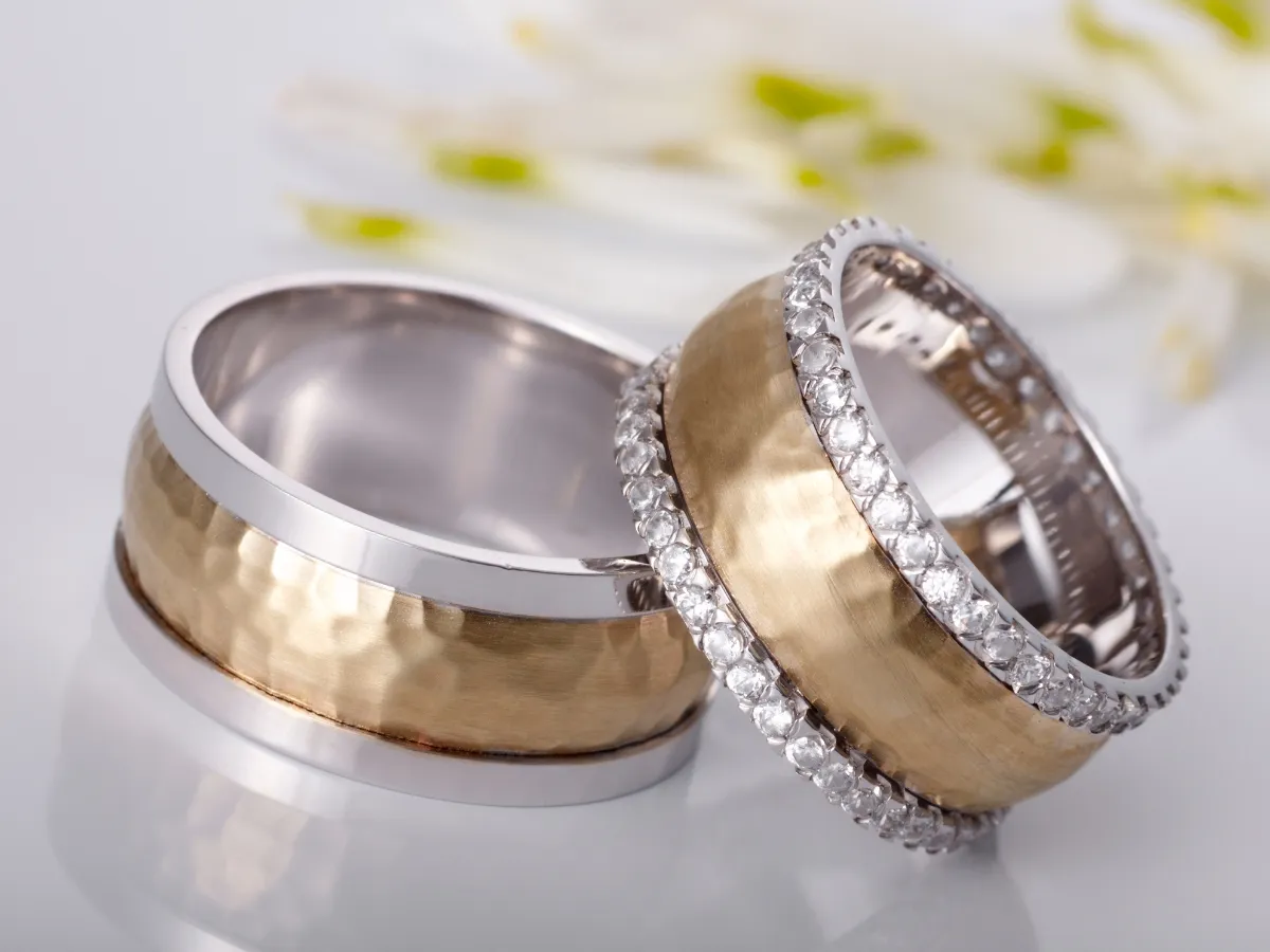 Two-tone hammered and diamond wedding rings