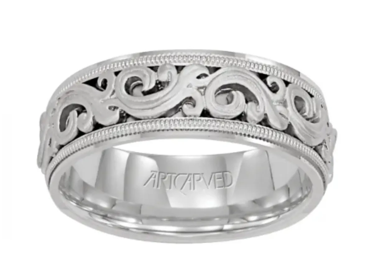 Silver wedding band with intricate scrollwork.
