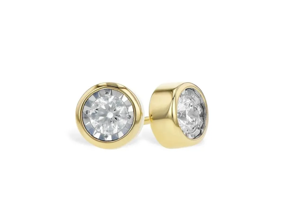 Gold stud earrings with large diamonds