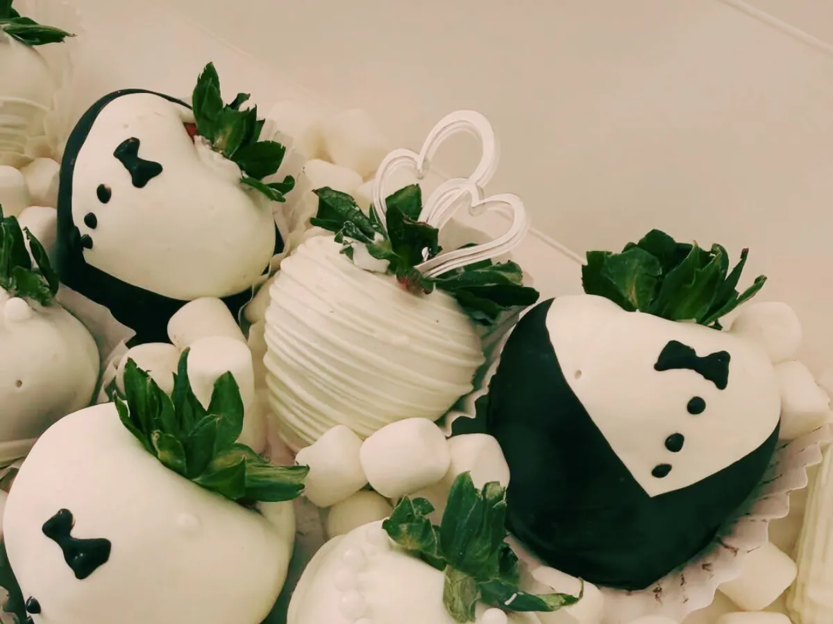 Tuxedo and bride chocolate-covered strawberries
