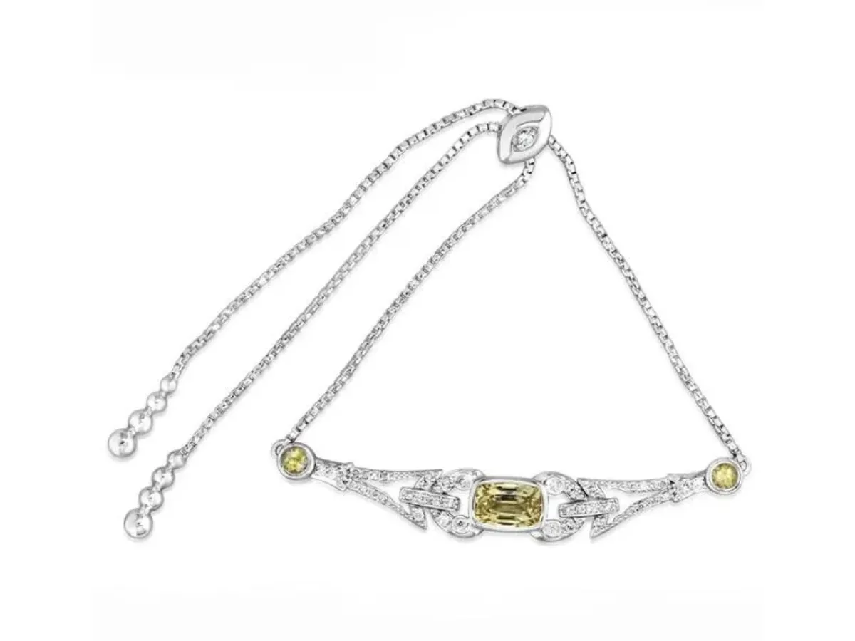 White gold bracelet with yellow gemstones
