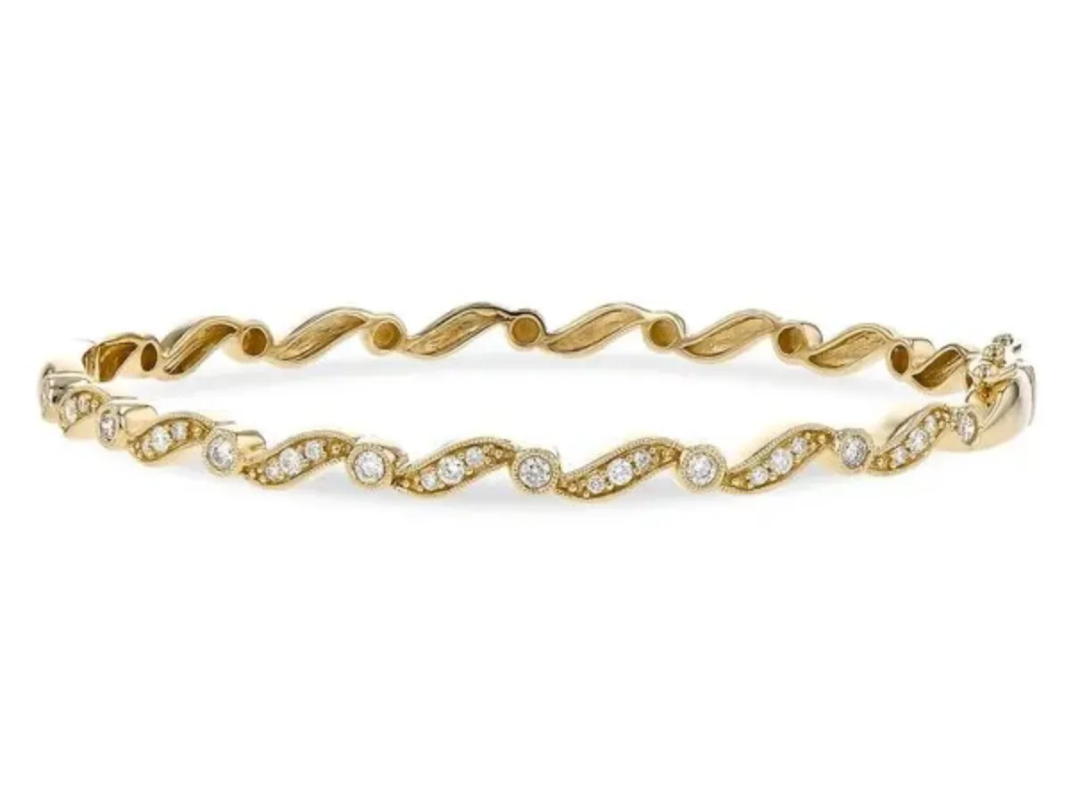 Gold bracelet with wavy diamond accents
