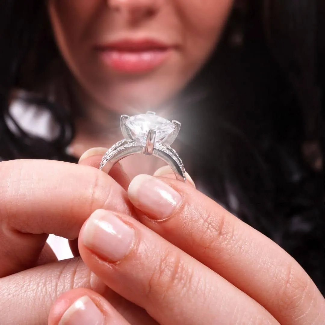 Woman displaying one-of-a-kind engagement rings